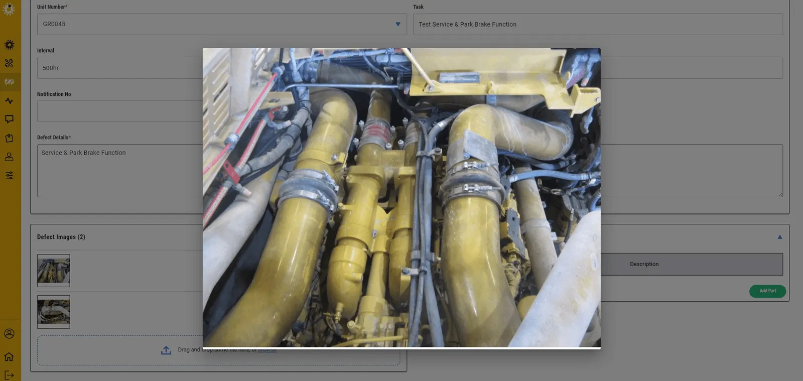 Raising a defect: unit number, interval, task, defect detail and photographic evidence attached at the point of work.